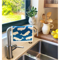 Whales Swedish Dishcloth draped over faucet at a kitchen sink - BESPOKE PROVISIONS
